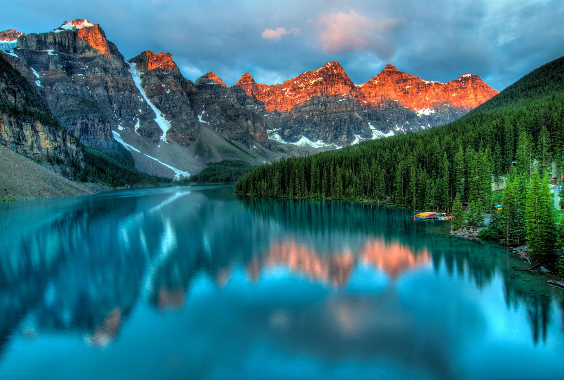 Mountains reflected in a calm turquoise lake